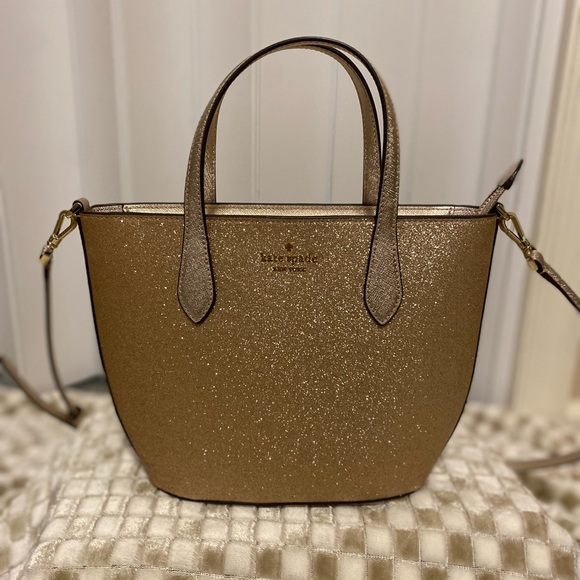 kate spade Handbags - Kate spade 
Kate spade leather gold purse 
Glitter leather 
Kate spade